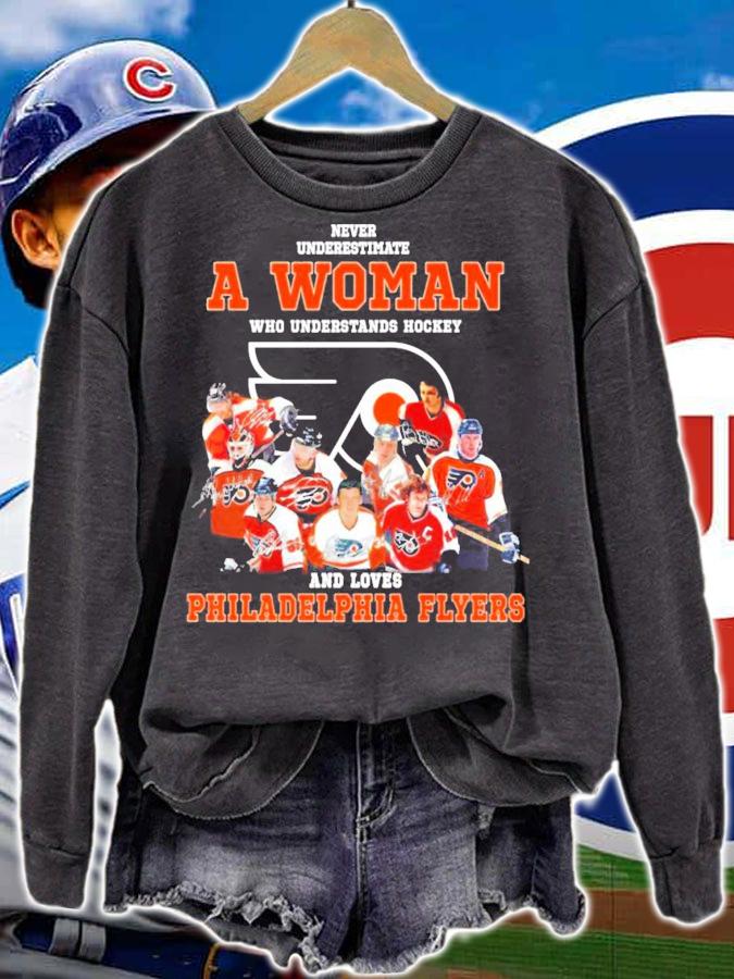 Never underestimate a woman who understands hockey and loves Philadelphia Flyers shirt sweatshirt